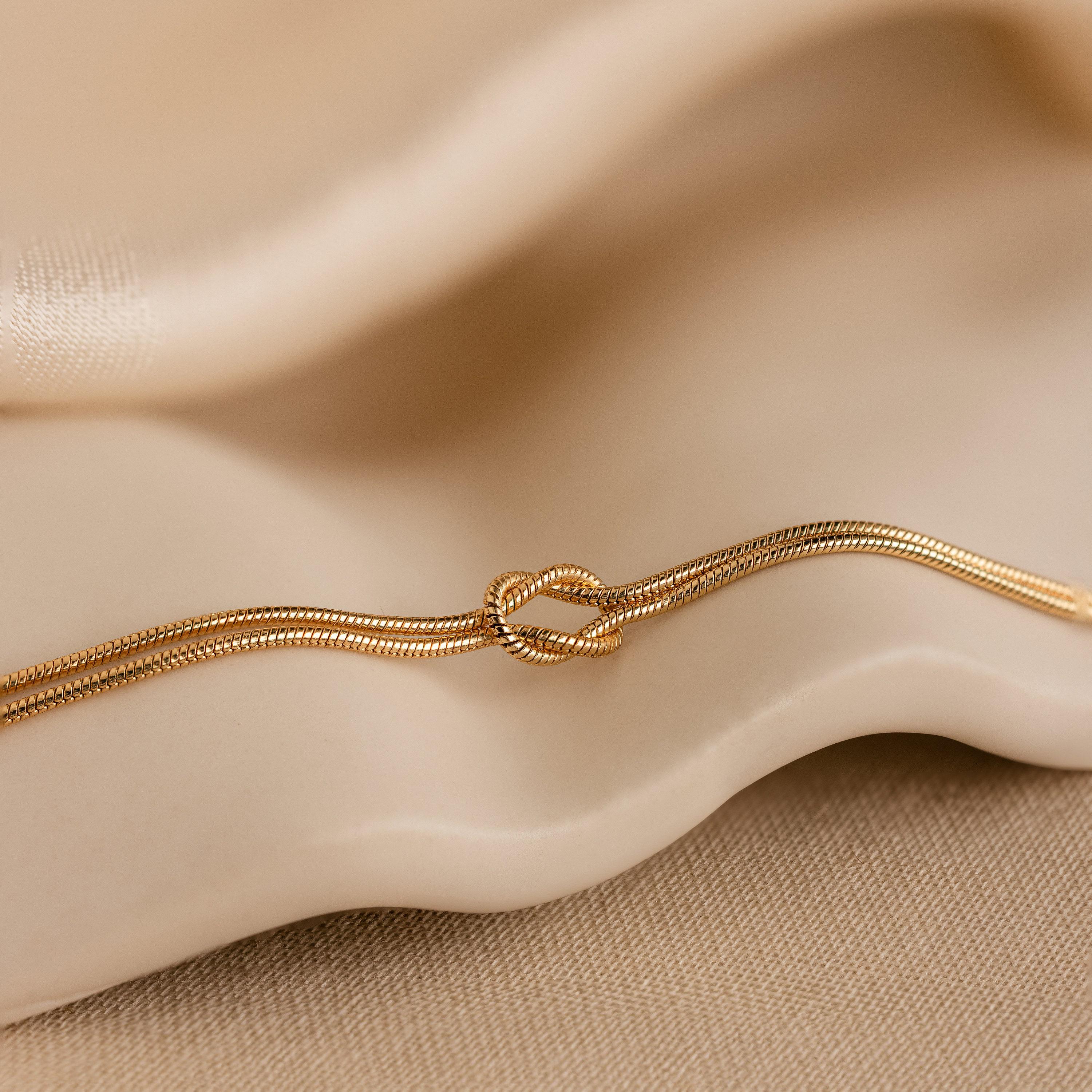 Double Snake Chain Love Knot Bracelet in 18K Gold Over Brass