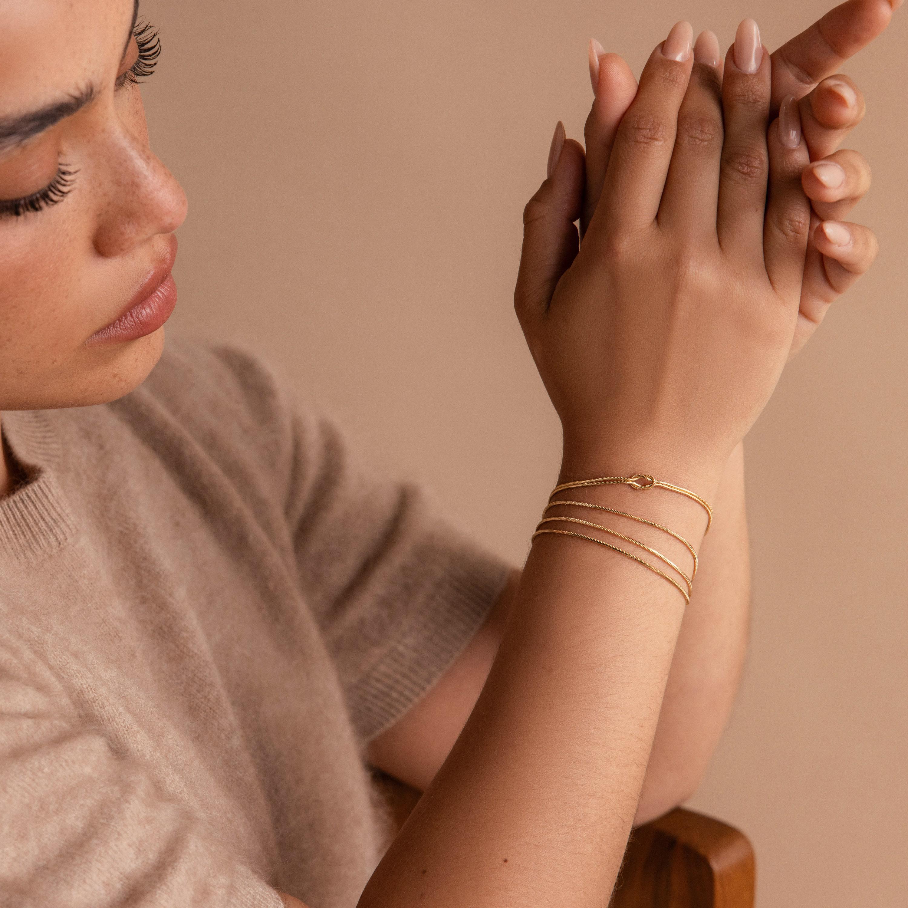 Double Snake Chain Love Knot Bracelet in 18K Gold Over Brass